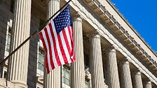 American flag blowing in the wind on Washington federal building