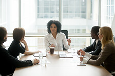 Woman in supply chain management meeting