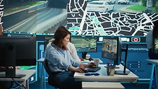 Employee navigating on satellite radar and map to search for routes