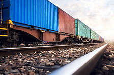 Train wagons carrying cargo containers for shipping companies. Distribution and freight transportation using railroads.