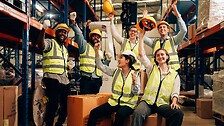 group of people in a warehouse