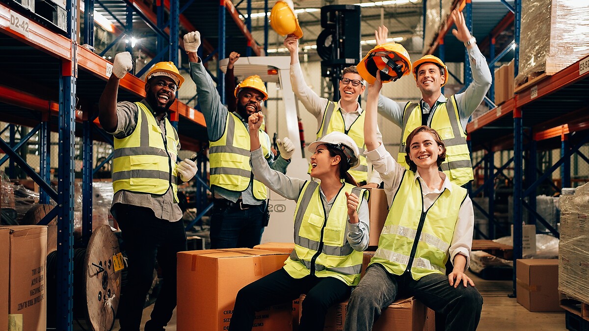 group of people in a warehouse