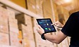 Warehouse and logistics workers using technology
