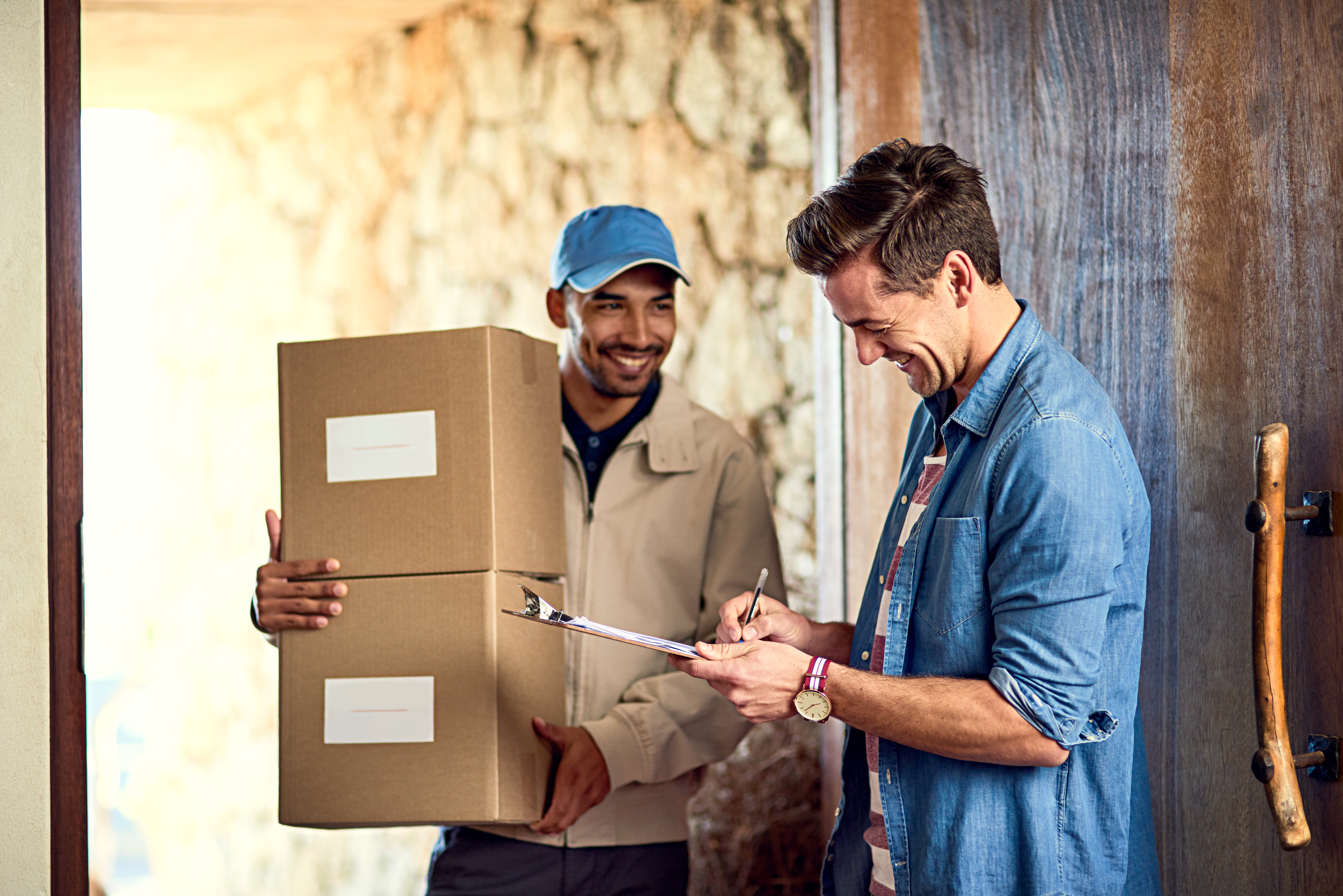man receiving parcel at home.jpg