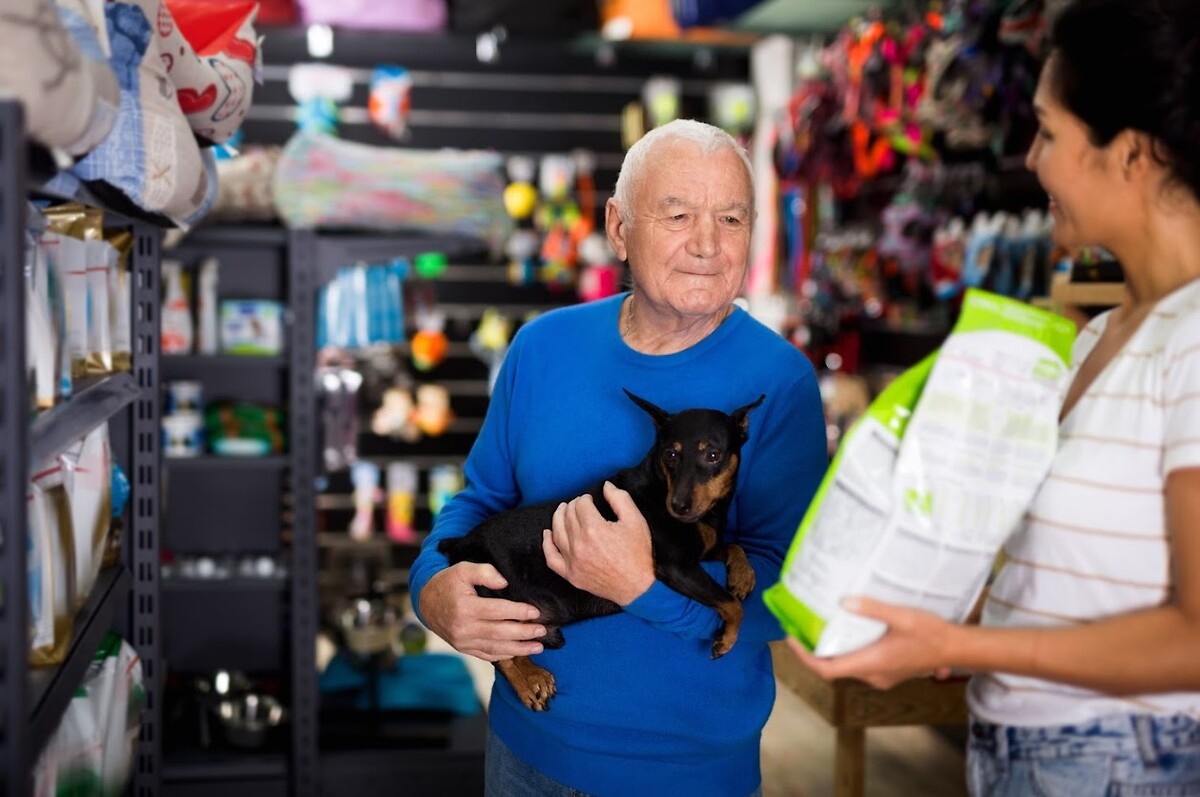Man with dog shopping for dog food