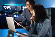 Multiracial female brokers share knowledge about financial investments in stock market.