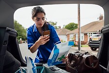 Nurse scanning parcel for pharmacy
