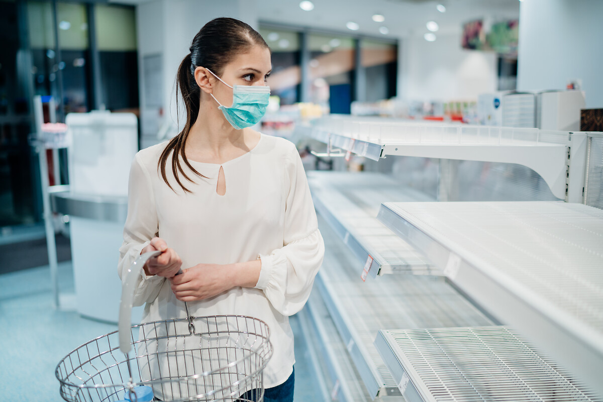 Women with mask in empty storage