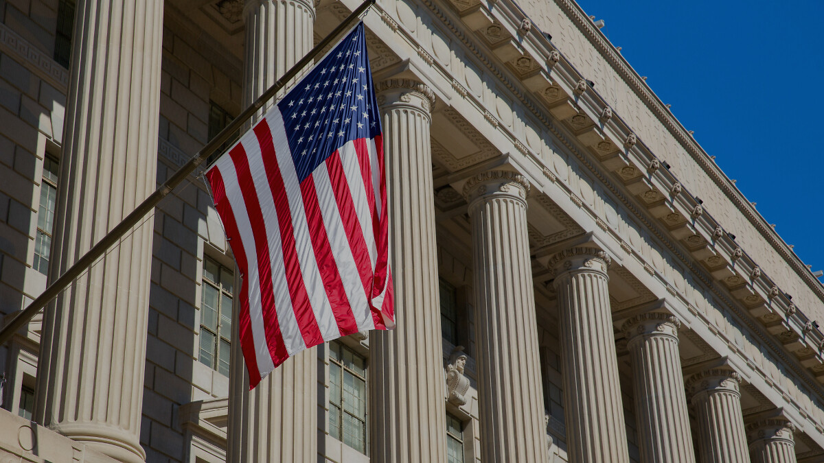 American flag blowing in the wind on Washington federal building