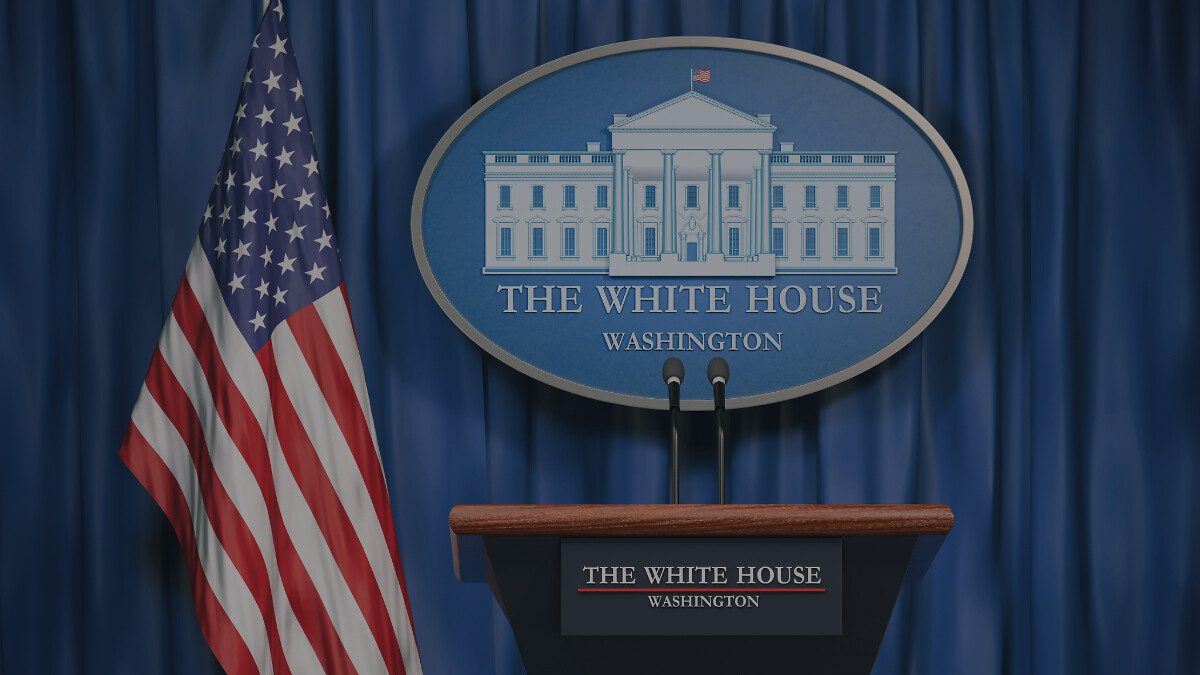 Podium speaker tribune with USA flags and sign of White House