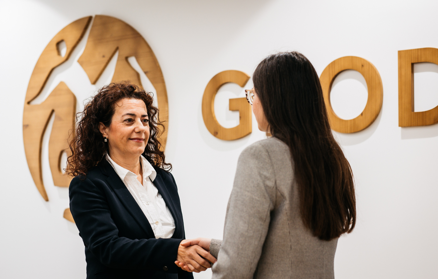 Two-women-working-in-the-logistics-industry-shaking-hands
