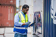 Container operator inspection containers box from cargo ship for export and import at container yards.
