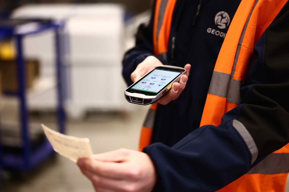 man scanning label in warehousing