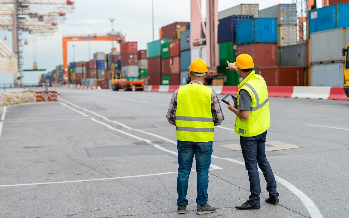 people_discussing_container_freight_tablet_port_3