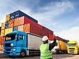 Person directing trucks with containers