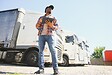 portrait African American men happy Smiling confident positive standing near lorry