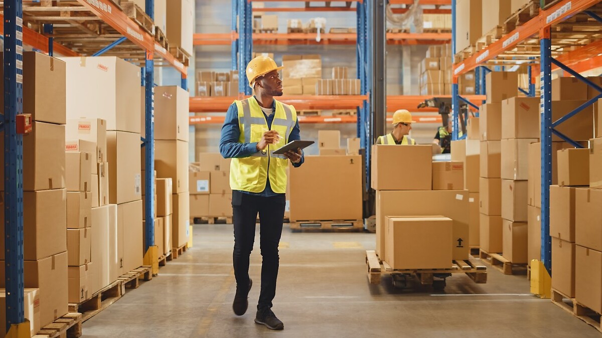 People and parcels in a warehouse