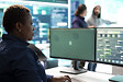Woman governmental hacker analyzing digital threats on a computer