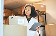 Woman with tablet reviewing medical goods