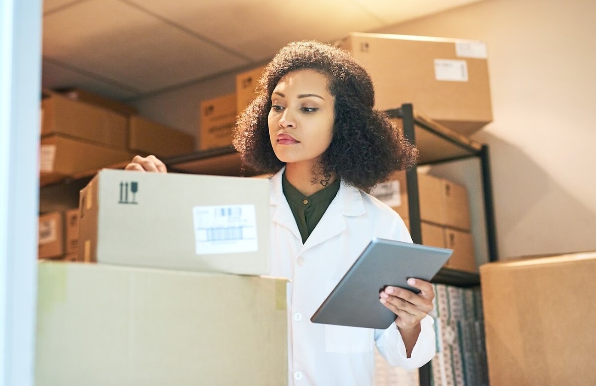 Woman with tablet reviewing medical goods